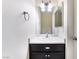 Clean bathroom with single vanity and dark cabinets at 932 Angel Star Ln, Las Vegas, NV 89145