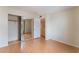 Spacious bedroom with mirrored closet and wood floors at 932 Angel Star Ln, Las Vegas, NV 89145