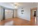 Well-lit bedroom featuring wood floors and window coverings at 932 Angel Star Ln, Las Vegas, NV 89145