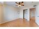 Bright bedroom featuring wood flooring and mirrored closet doors at 932 Angel Star Ln, Las Vegas, NV 89145