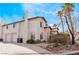 Two-story house with attached garage and landscaped yard at 932 Angel Star Ln, Las Vegas, NV 89145