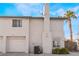 Rear view of the house with garage and AC unit at 932 Angel Star Ln, Las Vegas, NV 89145