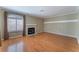 Living room with hardwood floors, fireplace and large window at 932 Angel Star Ln, Las Vegas, NV 89145