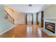 Living room with hardwood floors, fireplace and staircase at 932 Angel Star Ln, Las Vegas, NV 89145