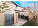 Small patio with built-in BBQ grills and small yard at 932 Angel Star Ln, Las Vegas, NV 89145