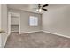 Well-lit bedroom with carpet, ceiling fan and walk-in closet at 950 Seven Hills Dr # 1512, Henderson, NV 89052