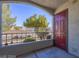 Private patio with red door and view of landscaping at 950 Seven Hills Dr # 1512, Henderson, NV 89052