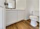 Clean bathroom with white vanity and wood-look floors at 9570 Lavarun Ct, Las Vegas, NV 89123