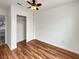 Bright bedroom with hardwood floors and ceiling fan at 9570 Lavarun Ct, Las Vegas, NV 89123