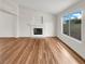 Bright living room featuring hardwood floors and fireplace at 9570 Lavarun Ct, Las Vegas, NV 89123