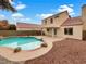 Inviting backyard pool with flagstone patio and landscaping at 9570 Lavarun Ct, Las Vegas, NV 89123