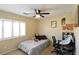 Cozy bedroom with ceiling fan and window shutters at 9843 Frosty Canyon Ct, Las Vegas, NV 89183