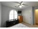 Well-lit bedroom with large window, closet, and ceiling fan at 9843 Frosty Canyon Ct, Las Vegas, NV 89183