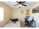 Bright bedroom with a comfortable bed, desk, and ceiling fan at 9843 Frosty Canyon Ct, Las Vegas, NV 89183