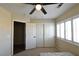 Bedroom with sliding door closet and window shutters at 9843 Frosty Canyon Ct, Las Vegas, NV 89183