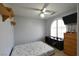 Cozy bedroom featuring an arch window and built-in shelves at 9843 Frosty Canyon Ct, Las Vegas, NV 89183