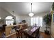 Bright dining room with hardwood floors, a large table, and a chandelier at 9843 Frosty Canyon Ct, Las Vegas, NV 89183