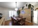 Formal dining room with hardwood floors, a large table, and a chandelier at 9843 Frosty Canyon Ct, Las Vegas, NV 89183