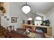 Spacious dining room with hardwood floors and a large chandelier at 9843 Frosty Canyon Ct, Las Vegas, NV 89183