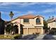 Two-story house with a three-car garage and landscaped yard at 9843 Frosty Canyon Ct, Las Vegas, NV 89183