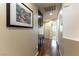 Hallway with wood floors, storage, and tasteful decor leads to other rooms at 9843 Frosty Canyon Ct, Las Vegas, NV 89183