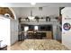 Kitchen with granite countertops and dark wood cabinets at 9843 Frosty Canyon Ct, Las Vegas, NV 89183