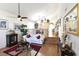 Spacious living room with hardwood floors, a white couch, and a ceiling fan at 9843 Frosty Canyon Ct, Las Vegas, NV 89183