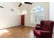 Inviting living room with wood floors, high ceilings, and ample natural light at 9843 Frosty Canyon Ct, Las Vegas, NV 89183