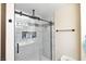 Updated shower with glass enclosure and modern tile at 9843 Frosty Canyon Ct, Las Vegas, NV 89183