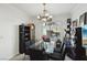 Bright dining room with modern chandelier, glass table, and stylish decor at 9916 Sierra Canyon Way, Las Vegas, NV 89147