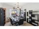 A dining room with a glass table and a view at 9916 Sierra Canyon Way, Las Vegas, NV 89147