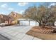 Two-story home featuring a concrete driveway and an attached two-car garage at 9916 Sierra Canyon Way, Las Vegas, NV 89147