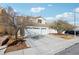 Two-story home featuring a concrete driveway and an attached two-car garage at 9916 Sierra Canyon Way, Las Vegas, NV 89147