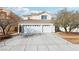 Two-story home featuring a concrete driveway and an attached two-car garage at 9916 Sierra Canyon Way, Las Vegas, NV 89147