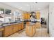 Well-lit kitchen with granite countertops, stainless steel appliances, and center island at 9916 Sierra Canyon Way, Las Vegas, NV 89147