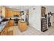 Functional kitchen with granite countertops, stainless steel appliances, and hanging pot rack at 9916 Sierra Canyon Way, Las Vegas, NV 89147