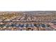 An expansive shot captures an organized neighborhood with closely spaced houses and tidy streets below at 9916 Sierra Canyon Way, Las Vegas, NV 89147