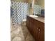 Clean bathroom with granite countertop, shower, and tile floor at , Henderson, NV 89011