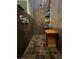 Large walk-in shower with granite walls and wooden seat at , Henderson, NV 89011