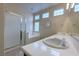 Bright bathroom with a double vanity, soaking tub, and glass-enclosed shower at , Las Vegas, NV 89123