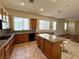 Well-equipped kitchen with a granite countertops and an island with seating at 8682 Waterford Bend St, Las Vegas, NV 89123