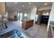 Open-concept kitchen featuring stainless steel appliances, granite countertops, and view of the living room at , Las Vegas, NV 89123