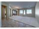 Spacious living room featuring neutral carpet, bright windows, and seamless flow to other living areas at , Las Vegas, NV 89123