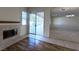 Cozy living room featuring a fireplace, and sliding glass doors that lead to the outdoor pool area at , Las Vegas, NV 89123