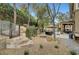 Landscaped backyard with stone steps, fire pit and pathway at 10213 Owls Peak Ct, Las Vegas, NV 89144