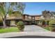 Two-story home with a manicured lawn and driveway at 10213 Owls Peak Ct, Las Vegas, NV 89144