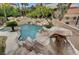 Luxury pool with rock waterfall and waterslide at 10213 Owls Peak Ct, Las Vegas, NV 89144