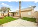 Landscaped backyard with covered patio and grassy area at 1036 Aspen Daisy Ave, Henderson, NV 89074