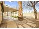 Landscaped backyard with a patio and palm trees at 1036 Aspen Daisy Ave, Henderson, NV 89074