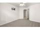 Well-lit bedroom with ceiling fan and wall-mounted TV at 1036 Aspen Daisy Ave, Henderson, NV 89074